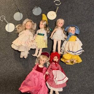 6 Effabbee Classic Doll Set with Colorful Dresses used with some stands vintage